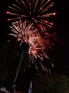 fireworks are lit up in the night sky