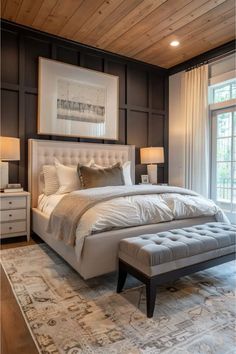 a large bed sitting in a bedroom on top of a wooden floor next to a window