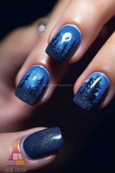 Embrace the night with this stunning moon nail design. Featuring a beautiful full moon and dark forest silhouette, this moon nail art is perfect for those who love a touch of mystery. Discover more at nailhow.com. Dark Blue Moon And Star Nails, Dark Blue Nails With Moon And Stars, Blue Moon Nails Art Designs, Blue Moon And Stars Nail Art, Night Sky Manicure, Beautiful Full Moon