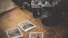 an old camera sitting on top of a map