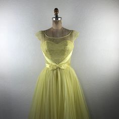 Vintage L 50s S Yellow Illusion Neckline Sweetheart Bust Bow Pleated Skirt Dress. Fits Approximately : Small; No Size Indicated - See Measurements. Bust : 34” Up To 36” With Darts Waist : 26” Bodice Length : 15.5” Overall Length : 45” Pre-Owned. Excellent Condition. Gently Worn. 0059vtg New To Poshmark? Use Code "Shesabettie" For $10 Off Your First Purchase! Fitted Tulle Skirt Tea-length Dress, Fitted Tea Length Dress With Tulle Skirt, Tea Length Tulle Skirt Dress, Vintage Sweetheart Neckline Dress For Prom, 1950s Style Dress With Sweetheart Neckline And Fitted Bodice, 1950s Style Dress With Sweetheart Neckline, Retro Dress With Sweetheart Neckline And Fitted Bodice, Retro Evening Dress With Sweetheart Neckline, 1950s Fitted Prom Dresses