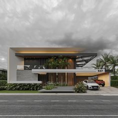 a modern house with two cars parked in front