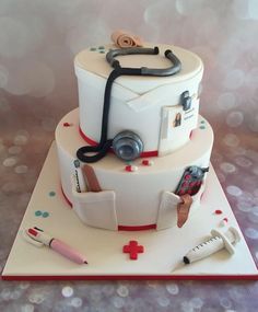 a cake with a stethoscope and medical equipment on it