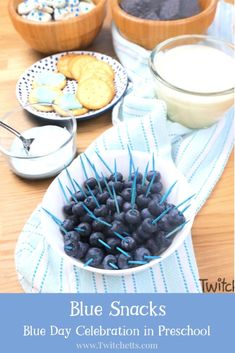 blue snacks are served in bowls on a table