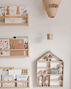 there are bookshelves and toys in the children's room on the wall