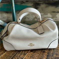 Coach Purse. Color Is Between Off White And Light Cream With Tan Interior And Gold Hardware. Used One Time And Has Been Stored In Closet Otherwise. Has Detachable Shoulder Strap. Like New. Smoke Free Home. Approximately 12” Long X 5.5” Wide X 7.5” Tall Bags Coach, Light Cream, Coach Purse, Coach Purses, One Time, Coach Bags, Gold Hardware, Satchel, Shoulder Strap