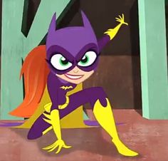 the animated batgirl is sitting on the ground