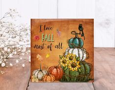 a card that says i love fall most of all with pumpkins and sunflowers