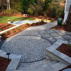 an outdoor patio with stone steps and landscaping