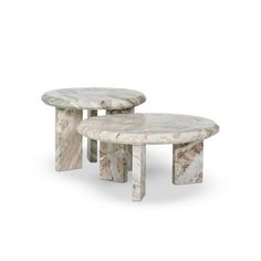 two marble tables sitting next to each other