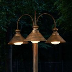 an outdoor lamp with three lamps on it