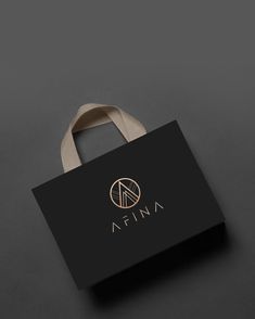 a black and white bag with the word affina on it's side