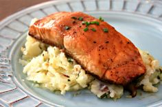 salmon and mashed potatoes on a blue plate