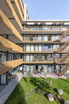 an apartment building with balconies on the second floor