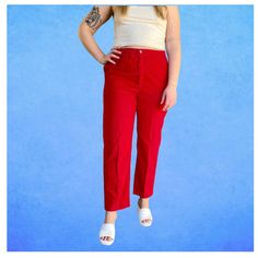 These vintage 80's trousers are such a cute yet comfy find. They are a beautiful bright red colour on a corduroy base. There are two deep pockets in the front and one in the back that has a button for closure. Additionally, the waist band is elastic to create a super comfortable fit. There is a button and red zipper that matches the pants. These trousers are in perfect condition as there are no stains, rips, or discolourations of any kind.  The care tag has been removed so I am not sure what material they are made out of. They have a minor amount of stretch to them but not much. The waist is 30 inches but can stretch to 41 inches since the waist band is elastic. For reference, the model has a 34/35 inch waist and 43 inch hips. If you have any additional questions or would like more photos Red High-waist Corduroy Bottoms, High Waist Red Corduroy Pants, Red Straight Leg Corduroy Bottoms, Red Corduroy Casual Pants, Casual Red Corduroy Pants, Red Wide Leg Corduroy Pants, Red Corduroy Bottoms With Pockets, Fitted Red Corduroy Pants, Red Fitted Corduroy Bottoms