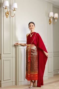 Our beautiful traditional Thai outfits are perfect for weddings, cultural events, Songkran festivals, or any occasion.  They are exclusively handmade with premium Thai silk & handwoven fabric. This set includes: 1 Free Size Silk Sabai Top 1 Free Size Patterned Skirt (can be worn with safety pins or hooks) 1 Set of hooks   This set does not include jewelry or accessories, they are available separately in our store. -- Check out our YouTube videos on how to wear your Thai dress: www.youtube.com/watch?v=jndYR-WrOuE www.youtube.com/watch?v=Eki5aUTxBBI&t=28s -- ชุดไทย, Thai attire, Thai costume, traditional Thailand clothing, that outfit, traditional Thai outfit, traditional Thai clothing, chut Thai, Thai wedding attire, Thai wedding dress, Thai traditional dress, Cambodian dress, Khmer dress, Luxury Traditional Wear With Pallu For Ceremonial Use, Luxury Traditional Wear With Self Design For Puja, Luxury Traditional Wear With Traditional Patterns For Formal Occasions, Luxury Chinon Traditional Wedding Wear, Luxury Traditional Sets For Ceremonial Occasion, Luxury Royal Traditional Wear For Festive Occasions, Corean Dress Traditional, Cheap Silk Traditional Wear For Festivals, Cheap Orange Traditional Wear For Puja