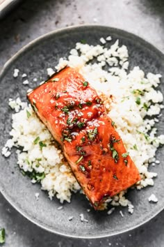 honey glazed salmon served over rice on a plate