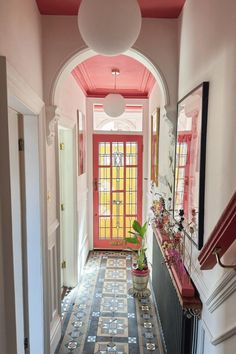 the hallway is decorated in pink and blue