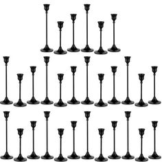 a set of black candlesticks are shown in different sizes and shapes on a white background