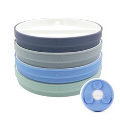 four bowls with lids are stacked on top of each other and one has a blue lid