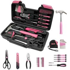 a pink and black tool set in a case with scissors, combs, hairbrushes, and other tools