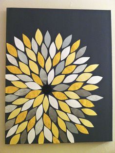 a yellow and gray flower on a black background is featured in this art work, which appears to be made with acrylic paint