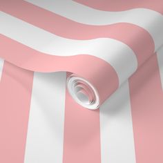 a pink and white striped wallpaper with an oval hole in the center on top