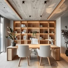 an office with wooden shelves and white chairs in front of a large open bookcase