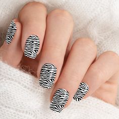 Make a bold statement with the Black and White Zebra Stripes Animal Print Minx Nail Art. This striking design features classic zebra stripes in black and white, creating a chic and timeless look. Perfect for any occasion, these nail wraps offer a stylish and sophisticated way to make your nails stand out. Easy to apply and remove, they provide a convenient and fashionable way to achieve salon-quality nails at home. Add a touch of wild elegance to your nail collection with these stunning Minx nail art wraps. Nail Collection, Zebra Nails, Minx Nails, Zebra Stripes, White Zebra, Manicure Set, Nails At Home, Nail Wraps, Design Features