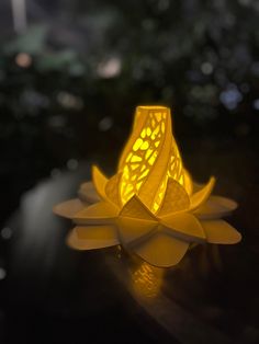 a yellow lamp sitting on top of a wooden table