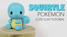 a small toy turtle sitting on top of a wooden stump with the words squirtle pokemon