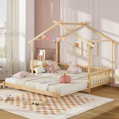 a child's bed with a wooden frame and canopy in a pink nursery room