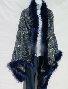 Unique Himalayan Yak/Sheep Wool Blend & Faux Fur Cape/Shawl/Wrap !!!…Ideal Unique Handcrafted gift for you, family, your friends and co-workers…!!! Handloomed/Handcrafted by Artisans Hand Embroidery Stitched Accents that Emphasize the Patterns in the Shawl Design,  Boiled Himalayan Yak/Sheep Wool Blend Shawl Handmade in Nepal Faux Fur | Black & Navy Tribal Design and Pattern A solid color Yak & Sheep Wool Blend of yarns hand loomed shawl in Nepal is handcrafted by a tribal family pattern and Ful Blue One Size Shawl For Winter, Blue One-size Winter Shawl, Blue Bohemian Outerwear For Festive Occasions, Blue One-size Poncho For Festivals, One Size Blue Poncho For Festivals, Blue One Size Poncho For Festival, Handmade Blue Shawl For Winter, Blue Bohemian Shawl Wrap, Blue Fall Shawl