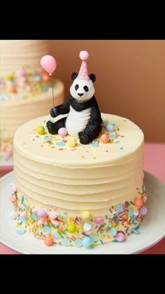 a panda bear cake with sprinkles and confetti on the top