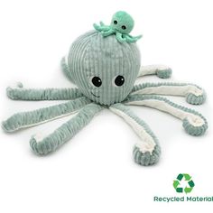 an octopus stuffed animal sitting on top of a white surface