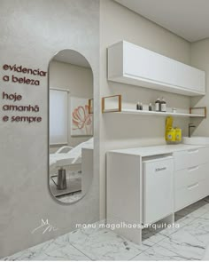 there is a bathroom with white cabinets and yellow accents on the wall, along with a mirror