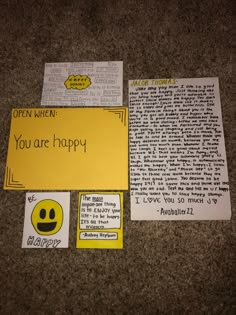 two pieces of paper with words written on them, one is yellow and the other says you are happy