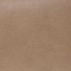 a brown leather texture background with small circles