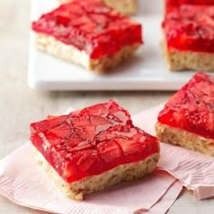 strawberry shortbreads on a white plate with pink napkin