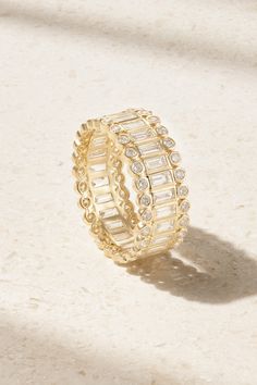 Eternity rings are a long-heralded symbol of never-ending love, and Sydney Evan's version is incredibly beautiful. Cast from 14-karat gold, it's set with continuous lines of sparkling baguette-cut diamonds surrounded by bezel-set, round-cut versions. It's housed in a designer-stamped box, rounding out the perfect gift to celebrate a milestone or anniversary. Luxury Gold Stackable Rings Channel Set, Luxury Gold Stackable Rings With Channel Set, Gold Luxury Stackable Rings With Channel Set, Luxury Gold Eternity Band With Channel Set, Luxury Gold Cubic Zirconia Eternity Band, Luxury Gold Channel Set Eternity Band, Fine Jewelry Gold Stackable Rings With Channel Set, Elegant Gold Stackable Rings With Baguette Cut, Luxury Gold Eternity Band Gift