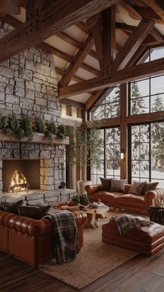 a living room filled with lots of furniture and a fire place in the middle of it