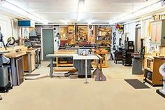 a room filled with lots of different types of workbench and tools on tables