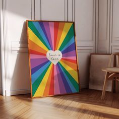 a multicolored photo frame with a heart on it in front of a chair