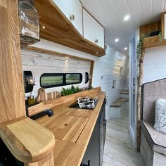 the interior of an rv with wood accents