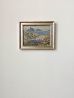 a painting hanging on the side of a wall