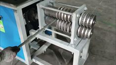 a machine that is working on some kind of wire spooling device in a factory