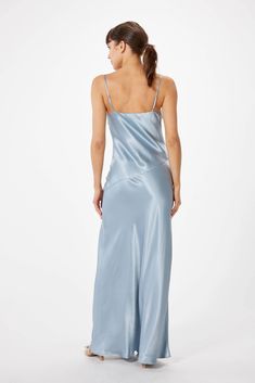 Experience the timeless presence of elegance with the SOPHIE RUE Ella Satin Slip Maxi Dress. Crafted with luxuriously soft satin, this slip dress moves with graceful fluidity and features adjustable spaghetti straps, a V-neckline, and a high slit for a flash of skin. Fully lined with a bias cut, this classic design will lend effortless grace to any affair - casual or formal. ** Sizing notes: This style runs TTS. Model is 5'8" and wearing a size S. MATERIALS: 53% Rayon 47% Viscose CARE: Hand wash Slip Maxi Dress, Satin Slip, Satin Dress, Slate Blue, Black Friday Sale, Satin Dresses, Brunei, Fabric Care, Spaghetti Strap