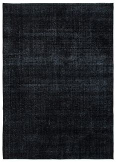 an old black rug on a white background