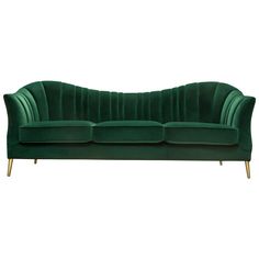 a green velvet couch with gold legs