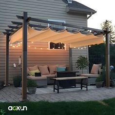 an outdoor patio with seating and lights